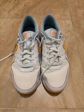 Nike White Sneakers with Orange Swoosh Accents